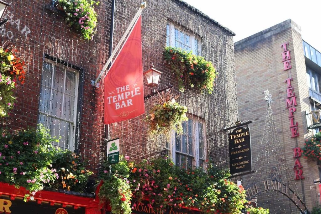 Iconic red facade and decorations of The Temple Bar in Dublin city centre